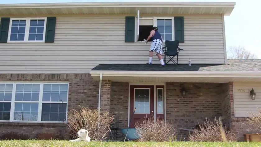 Video thumbnail: a player climbing out of a second-story window onto a roof with a lawn chair